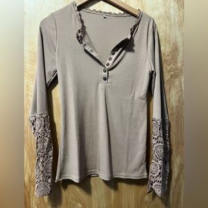 Fun sleeved top. Lightweight with cute floral details.